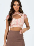 Crop top Lace material Floral print Cut out at front Single button fastening at neck