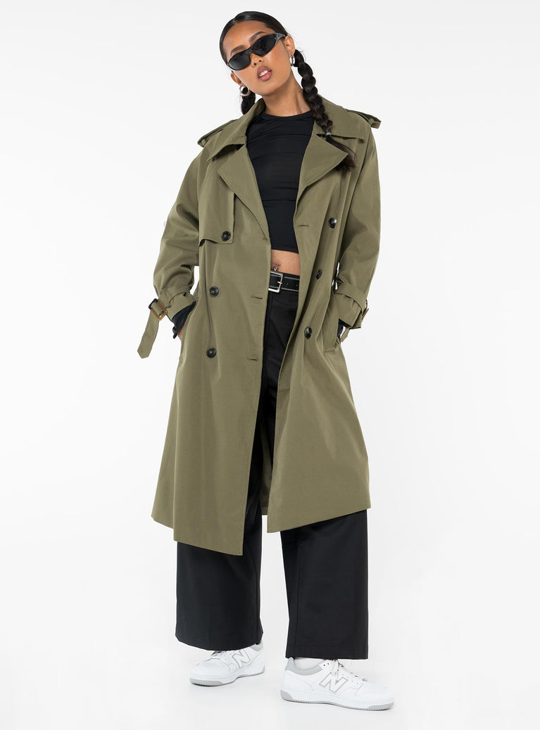 Trench coat Lapel collar, button fastening at front, twin hip pockets, removable waist tie, adjustable buckle cuff, split at back