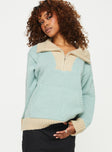 Quarter Zip Sweater  Oversized, ribbed cuffs and waist, single kangaroo pocket at front, high neck Zip fastening at front 