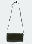 Olive shoulder bag Faux leather material Removable & adjustable shoulder strap Magnetic button fastening Single internal pocket External card slip at back Flat base