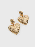 Heart shaped gold toned earrings