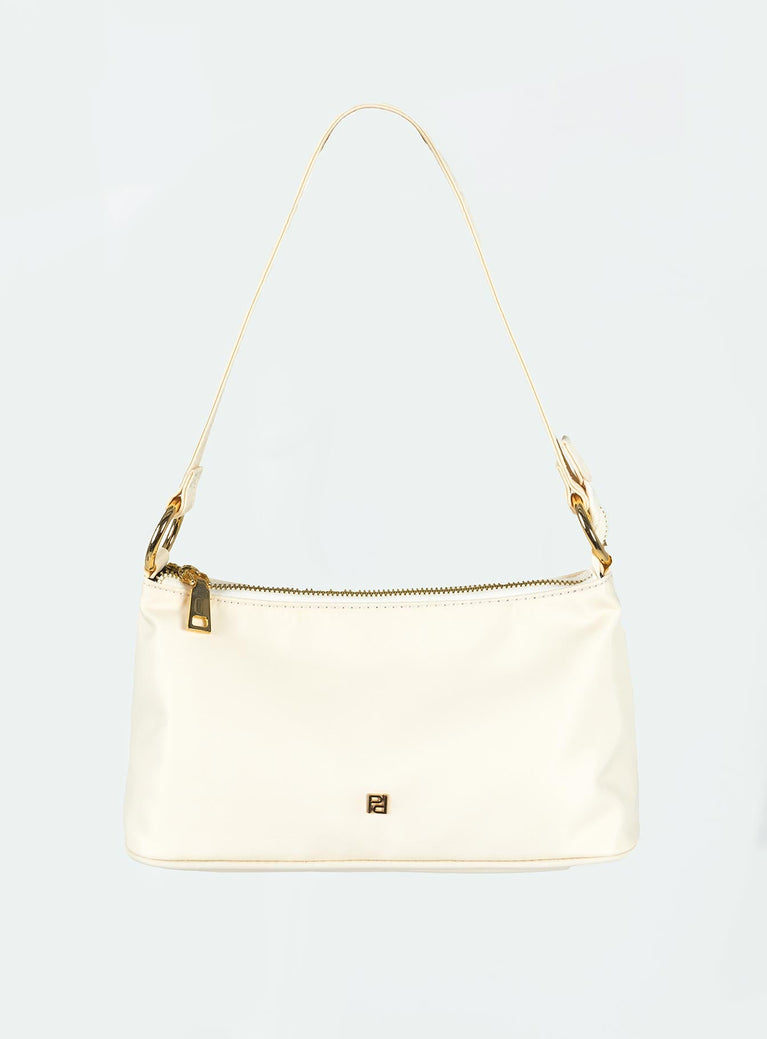 Shoulder bag Fixed strap Gold-toned hardware Zip fastening Two internal pockets Flat base