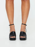 Faux leather heel Thick strap upper, ankle strap with buckle fastening, block heel