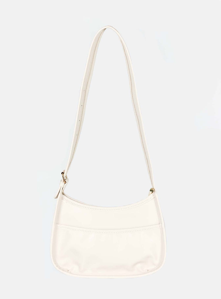 Cream crossbody bag Faux leather material Adjustable crossbody strap Gold-toned hardware Zip fastening Slip at back Flat base