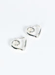 Silver toned earrings Hinged hoop fastening