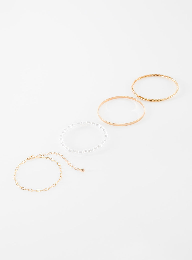 Gold-toned bracelet pack Four separate bracelets, chain and bangle style, pearl detail, lightweight 