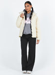 Puffer jacket High neck Zip front fastening Twin zip front pockets Ribbed cuffs