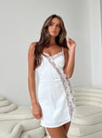 Mini dress Silky material Adjustable shoulder straps Lace trim  V neckline Invisible zip fastening at back