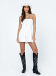 Strapless romper Lace details Ruffle neckline  Adjustable tie at neckline  Shirred back  Twin hip pockets 