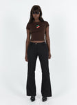 Black pants Low rise Belt looped waist Twin hip pockets Slim leg  Slightly flared cuff