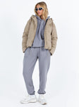 Beige puffer jacket Hood with drawstring Zip front fastening Twin front pockets Elasticated cuffs Drawstring waist