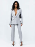 Blazer Sparkly material Lapel collar Button fastening at front Twin hip pockets Button detail at cuff Non-stretch