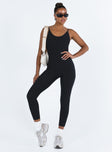 Black jumpsuit Ribbed material Scooped neckline Adjustable shoulder straps Good stretch Unlined 