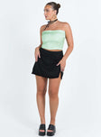 Black slim fitting mini skirt Invisible zip fastening at side Leg slit Lace trim Non-stretch Unlined