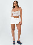 Mini skirt Crochet knit material Mid-rise V-waist Invisible zip fastening at side Slight stretch 