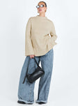 Sweater Ribbed material Mock neckline Splits at side hem Flared cuff