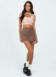 Crop top Lace material Floral print Cut out at front Single button fastening at neck