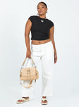 White pants Belt looped waist Zip and button closure Four pocket design Wide leg