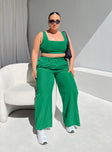 Matching set green Crop top Fixed straps Invisible zip fasting at side High waisted pants Wide relaxed leg Belt loops at waist Zip & button fastening