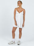 Mini dress Muslin look material Adjustable shoulder straps   Plunging neckline Ruffle detail  Elasticated back