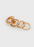 Gold-toned ring pack Four rings in pack, each ring uniquely different 