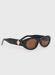 Sunglasses Oval-shaped lenses, brown-tinted lenses, black frames, brass-tone hardware detail