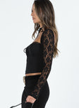 Long sleeve top Sweetheart neckline Adjustable shoulder straps Tie detail at bust Sheer lace sleeve