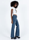 Highwaisted jeans Mid wash denim Belt looped waist Front button and zip fastening Four pocket design Flared leg Good Stretch  Unlined 