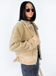 Aviator jacket Faux fur material  Large collar  Bucket fastening at neckline Zip front fastening  Twin hip pockets  Buckles at hem 