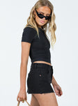 Micro mini skirt Black denim Low rise Belt looped waist Zip & button fastening Classic five pocket design Raw edge hem