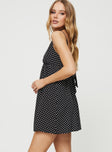 Polka dot print mini dress V neck, gathered detail at bust, adjustable shoulder straps, tie fastening at back, elasticated back