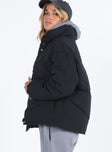 Black puffer jacket High neck Zip front fastening Twin zip front pockets Ribbed cuffs