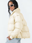 Two in one puffer jacket and vest High neck  Zip front fastening  Twin hip pockets  Drawstring waist 