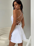 White mini dress Silky material Adjustable shoulder straps Low back Lace up back with tie fastening Invisible zip fastening at side