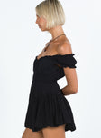 Black mini dress Shirred waistband Ruffle detailing Elasticated neck and sleeves Can be worn on or off shoulder Built in shorts Layered ruffle hem Fully lined