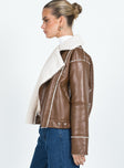 Jacket Faux leather material Faux fur lining Silver-toned hardware Classic collar Zip fastening at front Twin hip pockets