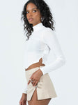 Long sleeve top Semi-sheer material  Mock neck  Rounded hem 