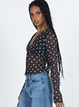 long sleeve black top Sheer material Polka dot print V-neckline Button fastening at front Waist tie fastening at back