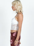 Lace cami top, slim fitting, v-neckline Fixed shoulder straps, frill detail