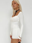 White long sleeve romper Ribbed knit material Sweetheart neckline Good stretch