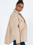 Beige jacket Soft material Pointed collar Button fastening at front Twin chest pockets Single button cuff