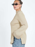 Sweater Ribbed material Mock neckline Splits at side hem Flared cuff