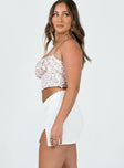 Mini skirt Crochet knit material Mid-rise V-waist Invisible zip fastening at side Slight stretch 