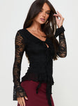 Black Long sleeve top Lace material, v neckline, tie fasting at front, frill detail throughout