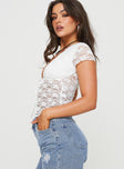 Lace crop top Plunging neckline, tie fastening at bust, pointed hem