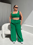 Matching set green Crop top Fixed straps Invisible zip fasting at side High waisted pants Wide relaxed leg Belt loops at waist Zip & button fastening