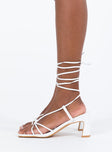 White heels Faux leather material  Strappy upper  Shaved block heel  Square toe  Ankle wrap fastening
