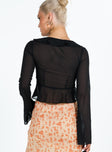 Long sleeve top Sheer material Frill neckline and hem Tie fastening at bust Flared sleeves