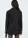 Oversized blazer Lapel collar  Button front fastening  Twin hip pockets  Faux chest pocket  Four-button cuffs  Satin lined 