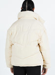 Puffer jacket High neck Zip front fastening Twin zip front pockets Ribbed cuffs